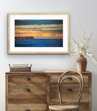 Load image into Gallery viewer, Soft afternoon light illuminates the distant cliffs and clouds across the bay's blue waters. Jervis Bay, NSW.
