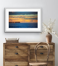 Load image into Gallery viewer, Soft afternoon light illuminates the distant cliffs and clouds across the bay's blue waters. Jervis Bay, NSW.