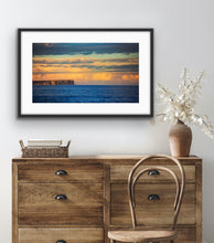 Load image into Gallery viewer, Soft afternoon light illuminates the distant cliffs and clouds across the bay's blue waters. Jervis Bay, NSW.