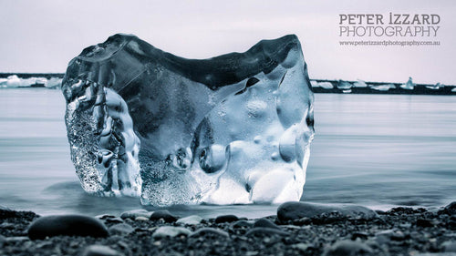 Jökulsárlónn, Iceland, I was captivated by the faceted colours of this particularly beautiful block of ice, one of thousands broken off from the main glacier, and now floating out to sea from the lagoon. Peter Izzard Photography Fine Art Print. 